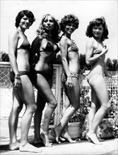 Jan. 01, 1950 - L - File Photo: circa 1940s-1950s, location unknown. Girls posing in bikini's in fashion shows, shoots and on beaches tanning. According to the official version, the modern bikini was ...