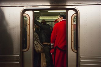 Christmas revelers participating in the annual Santacon travel on the subway in New York on Saturday, December 10, 2011. Santacon, primarily a pub crawl in Santa and other Christmas related costumes, ...